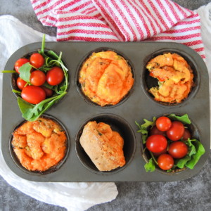 overhead view of a baking tin with 4 mini quiches inside