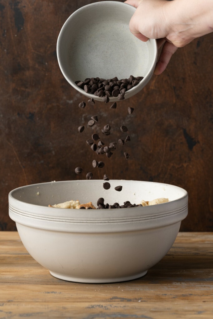 Adding chocolate chips to bread pudding