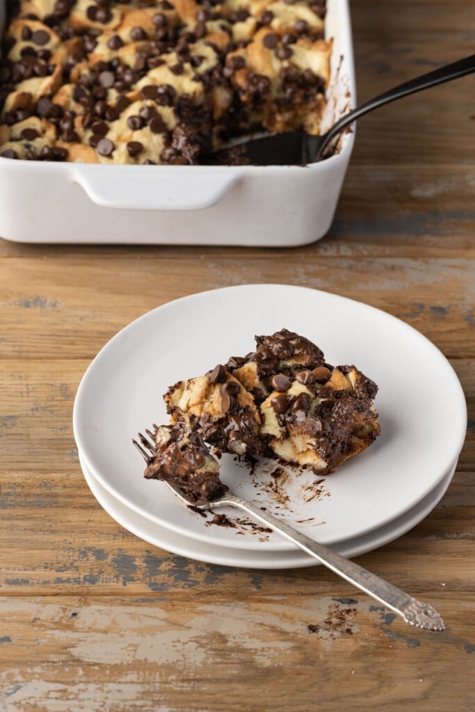 Slice of Chocolate Chip Bread Pudding with fork on a plate