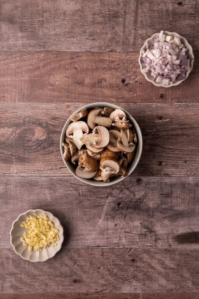 Diced shallots, sliced mushrooms, and minced garlic