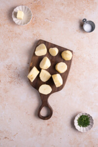 Cutting Russet potatoes into small wedges to speed up cooking time