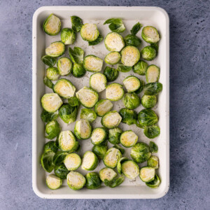 brussels sprouts with olive oil, salt, and pepper ready to roast
