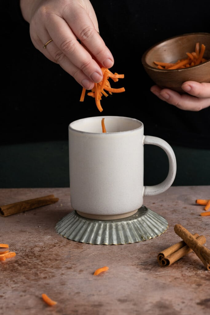 Adding matchstick carrots to Carrot Mug Cake
