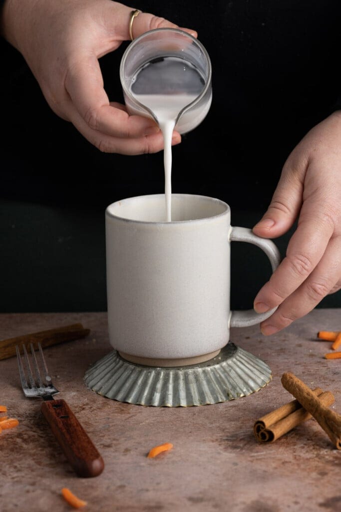 Adding milk to single-serving carrot cake batter