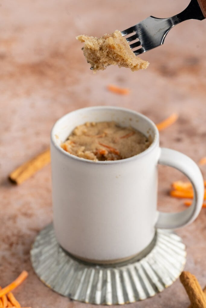 Carrot Mug Cake with forkful taken out