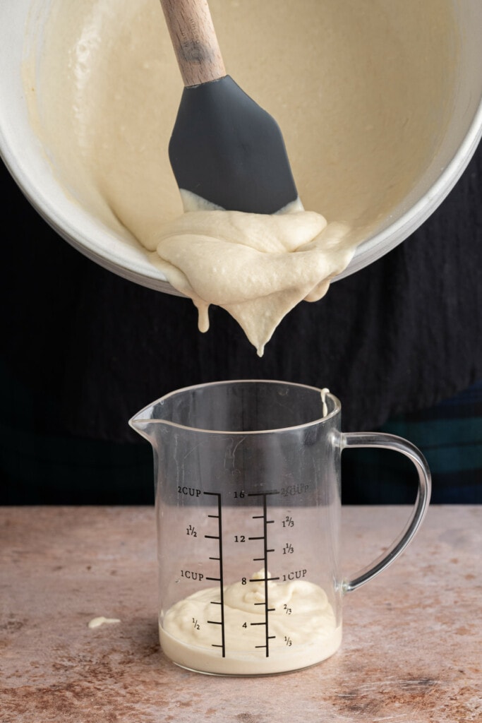 Transferring dairy-free waffle batter to measuring cup for easier pour