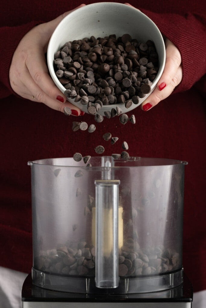 Adding chocolate chips to food processor to make homemade hot cocoamix