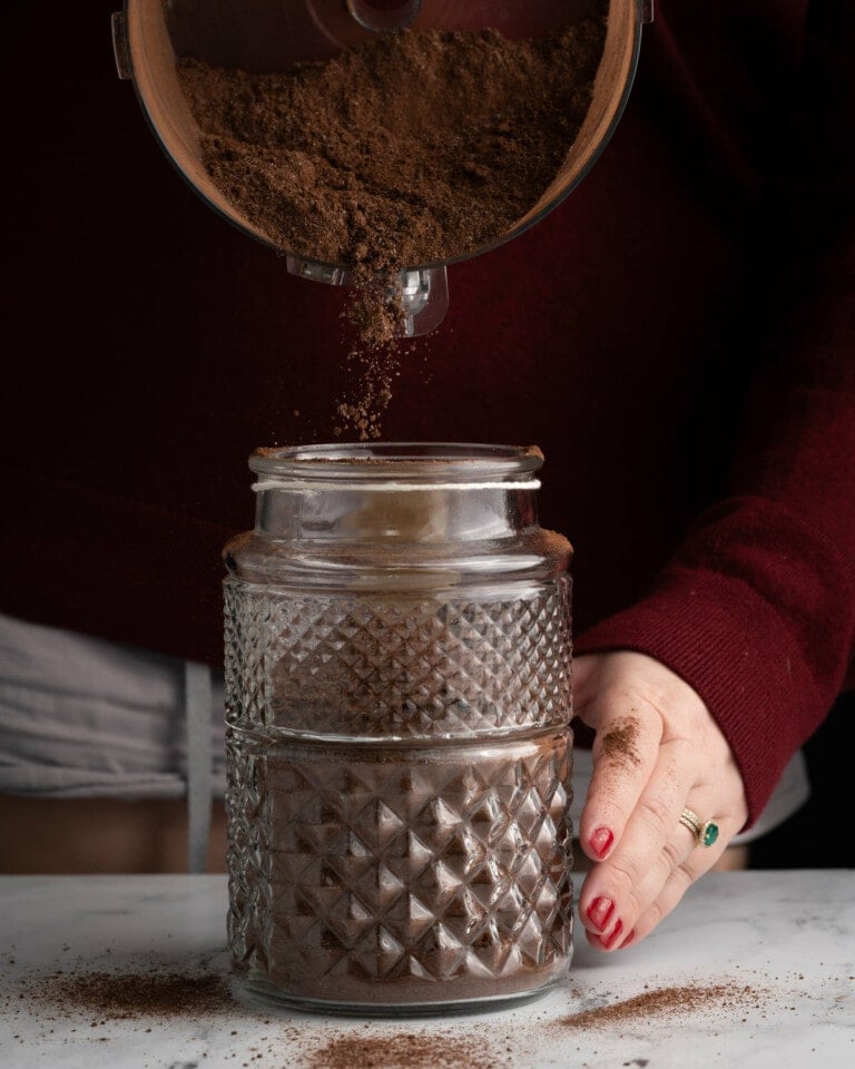 Transferring hot chocolate mix to airtight container to store