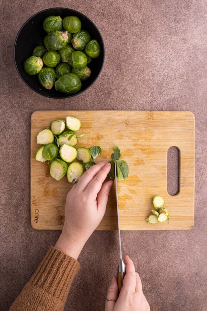 Prepping brussels sprouts to make Maple Balsamic Brussels Sprouts