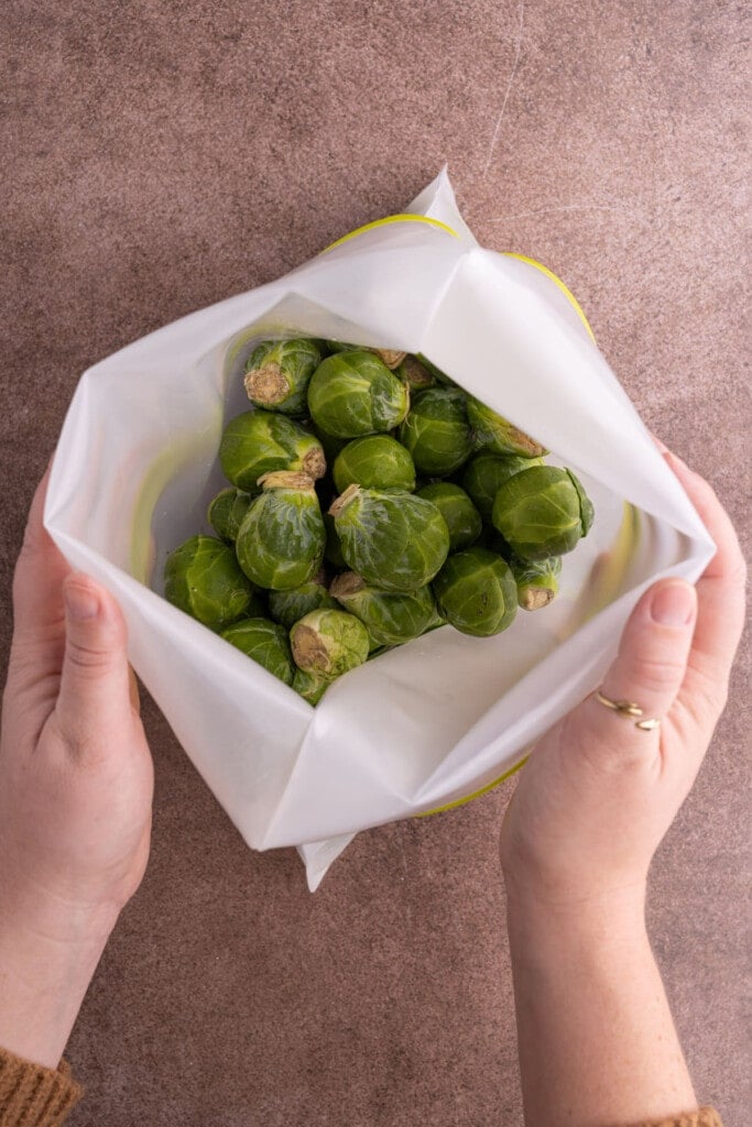 Storing brussels sprouts in a reusable storage bag to keep them fresh