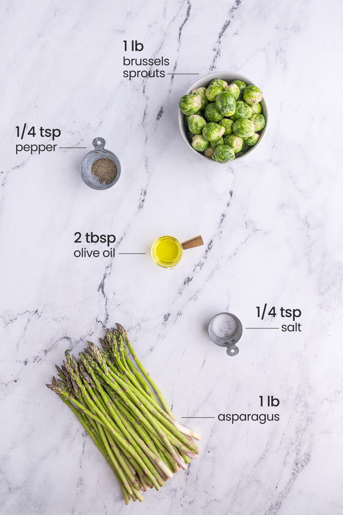 ingredients for roasted asparagus and brussels sprouts - brussels sprouts, pepper, olive oil, salt, asparagus