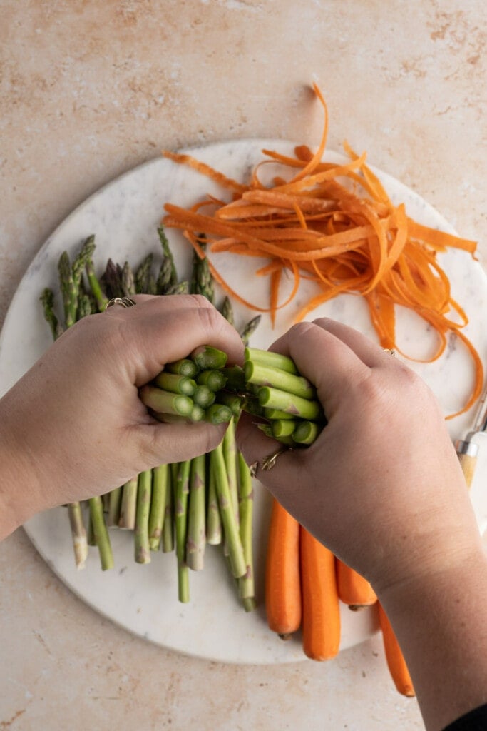 Snapping asparagus to break woody ends off