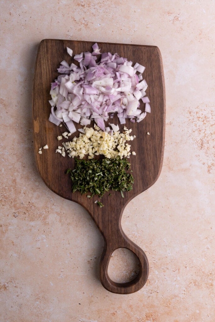 Prepping shallots, garlic, and rosemary