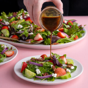 Adding quick dressing to Strawberry Goat Cheese Salad