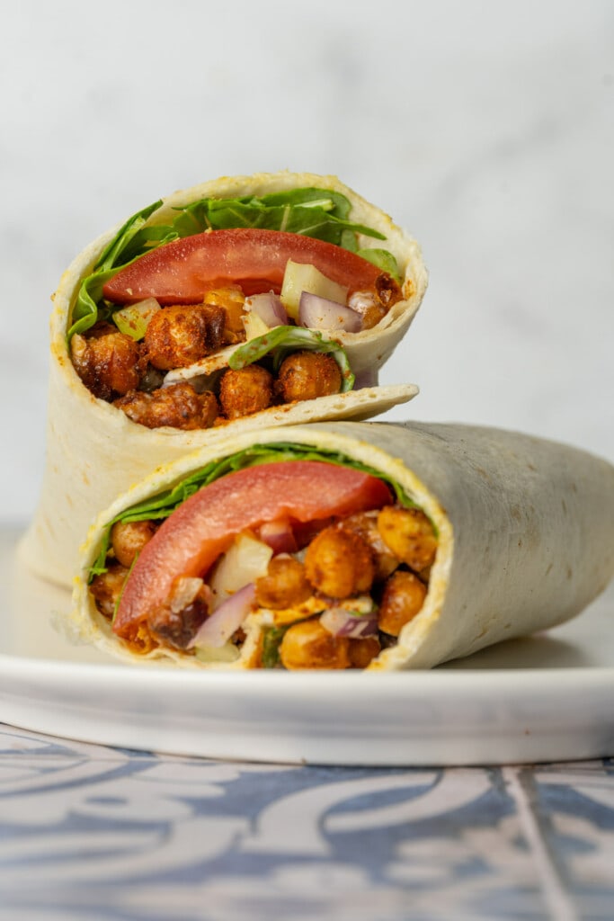 Two halves of Buffalo Chickpea Wrap stacked on top of eachother