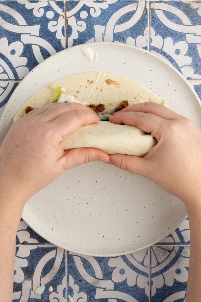 Rolling up a roasted chickpea wrap.