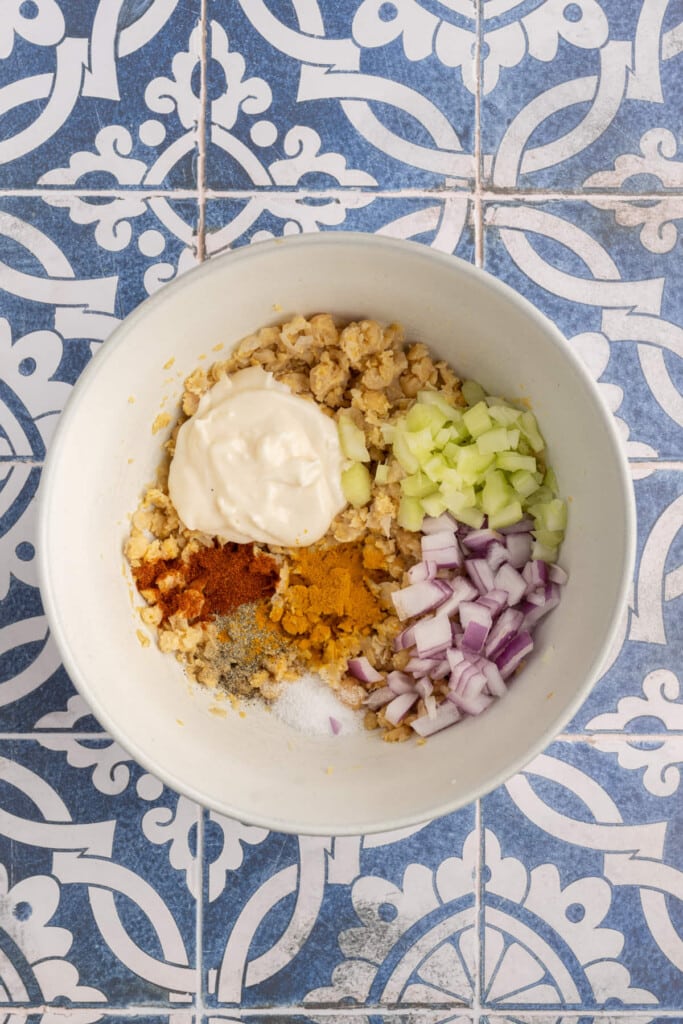 All ingredients for vegan egg salad substitute in a large mixing bowl