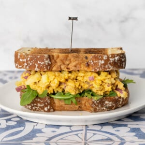 Vegan Egg Salad substitute on toasted bread with greens