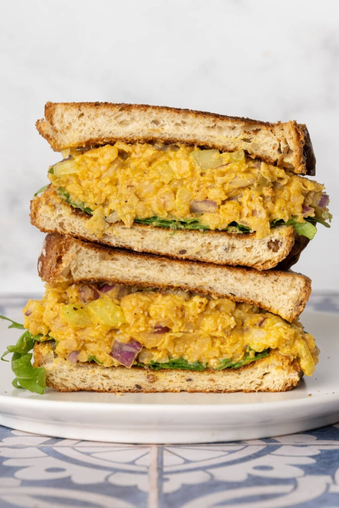 Both halves of Chickpea Egg Salad Sandwich stacked on top of eachother