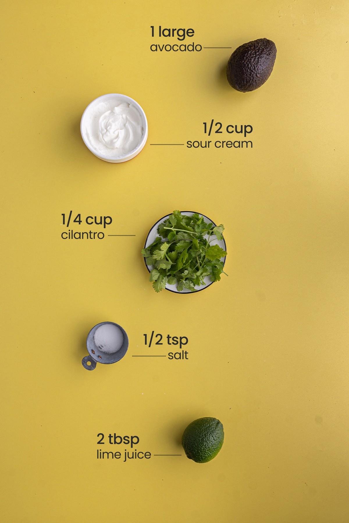 ingredients for avocado crema to put on sweet potato quinoa bowl - avocado, sour cream, cilantro, salt, lime juice