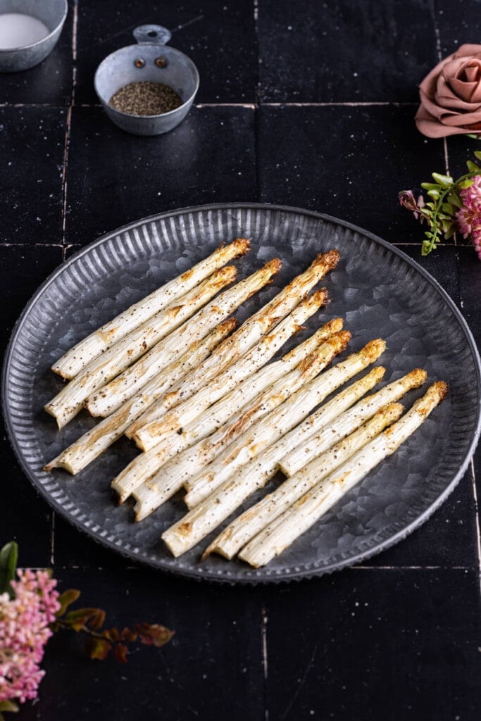 Roasted white asparagus on a platter