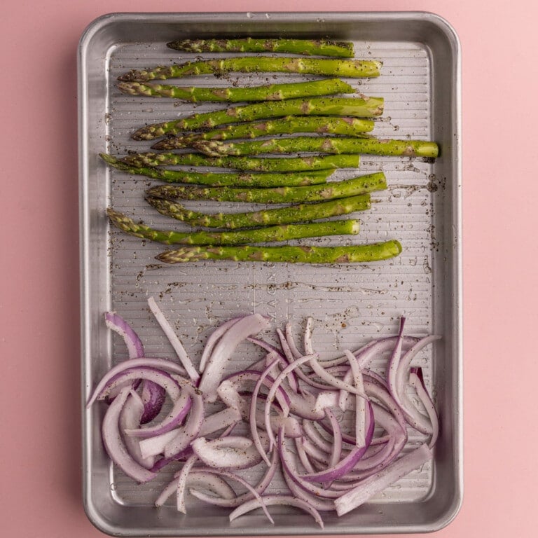Asparagus and red onion tossed in olive oil, salt, and pepper