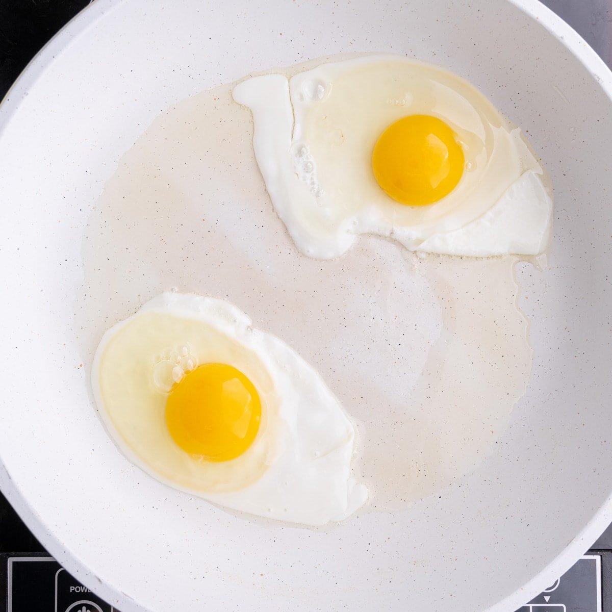 https://marleysmenu.com/wp-content/uploads/2023/01/Over-Hard-Eggs-Frying-in-a-Pan.jpg