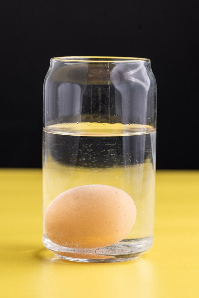 Testing if an egg is fresh by submerging it in water