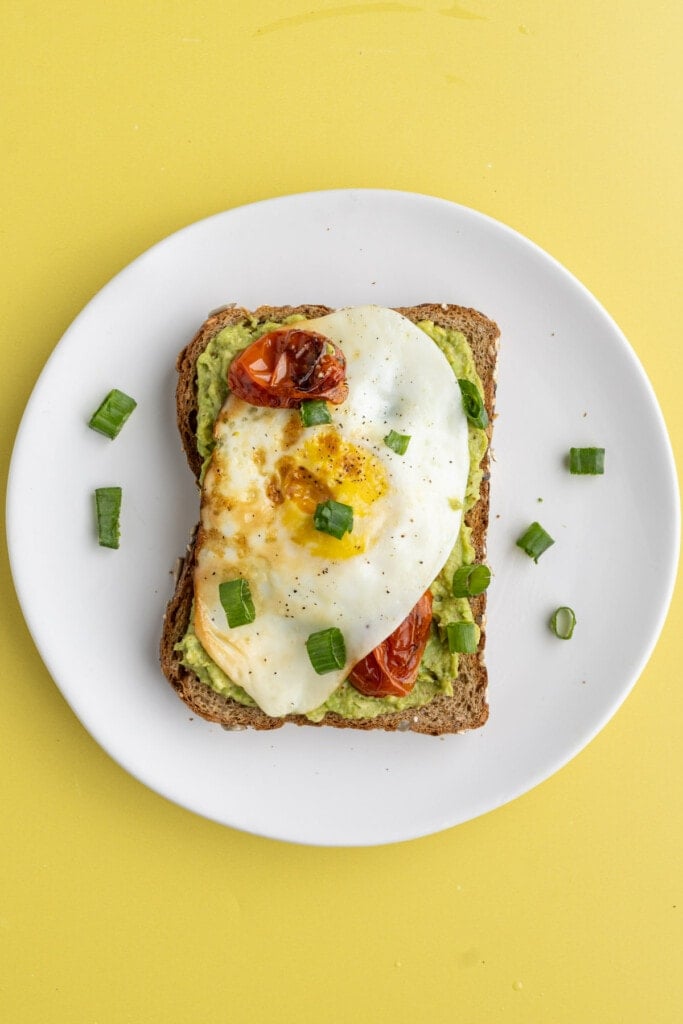 Serving up an over hard egg on avocado toast