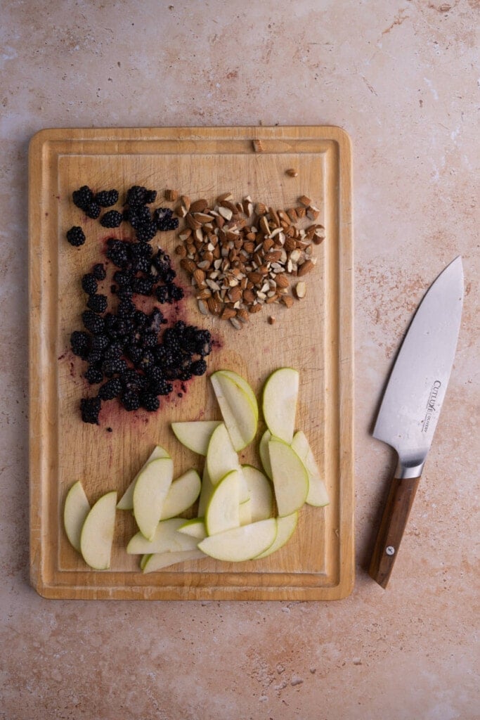 Prepping fruit and nuts for Quinoa Arugula Salad