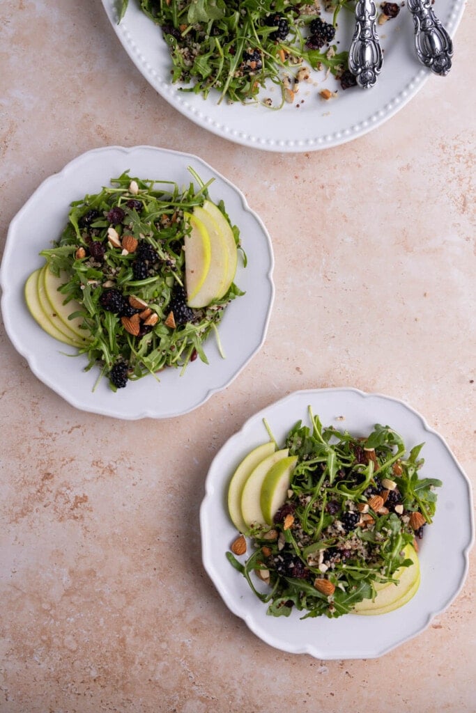 Two fresh plates of Arugula Quinoa Salad