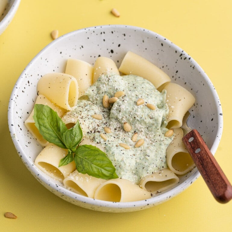 Bowl of Ricotta Pesto Pasta with a fork