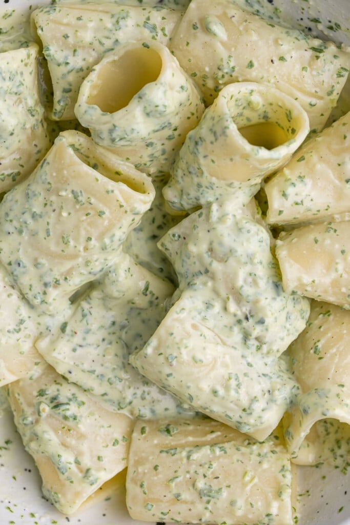 Super close up of pesto pasta with ricotta