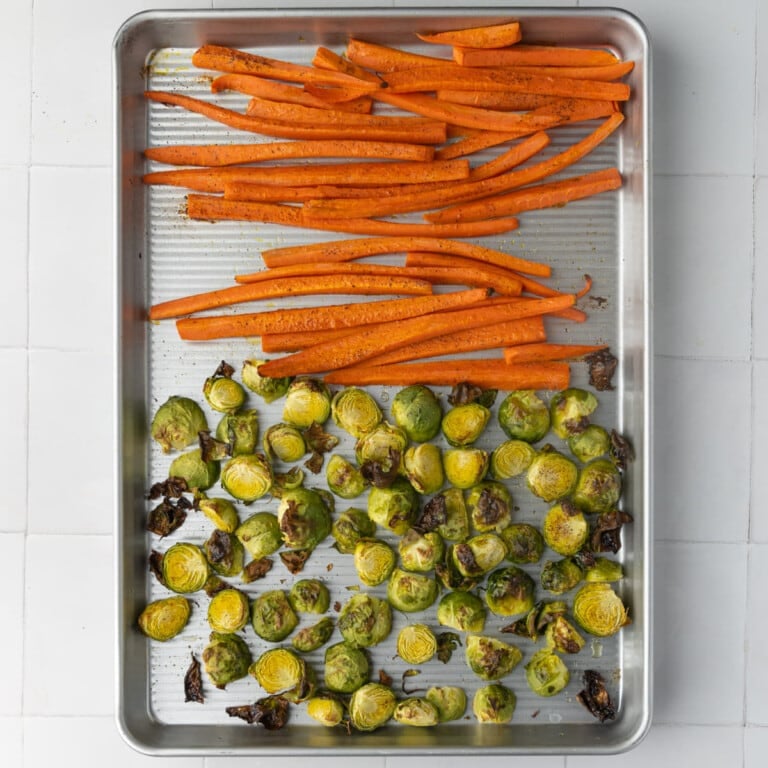 Sheet pan with just-roasted brussels sprouts and carrots