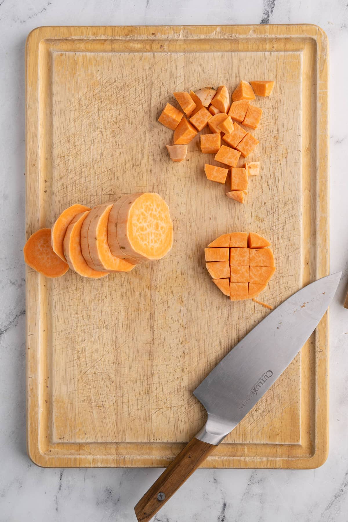 cutting sweet potato into small cubes