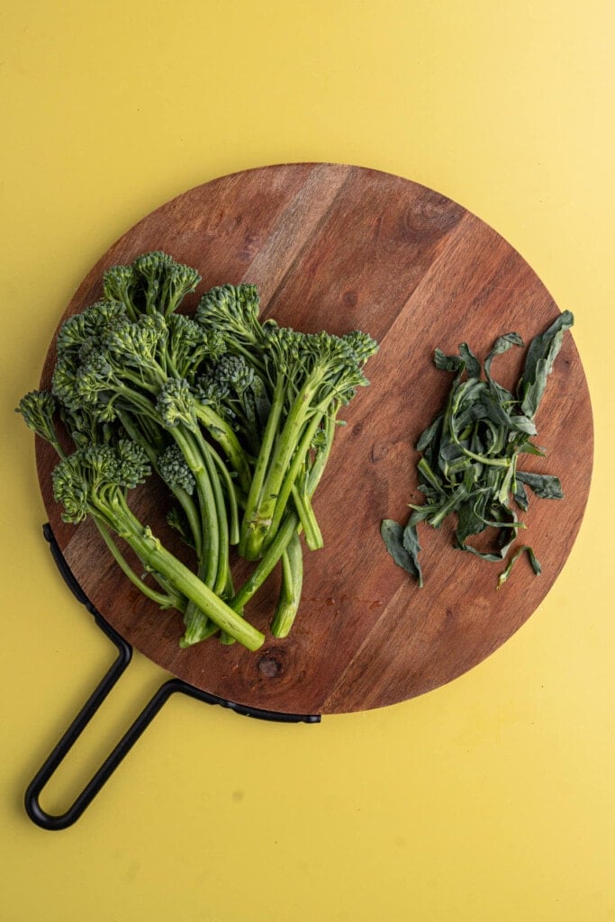 Removing leaves from broccolini to sautee