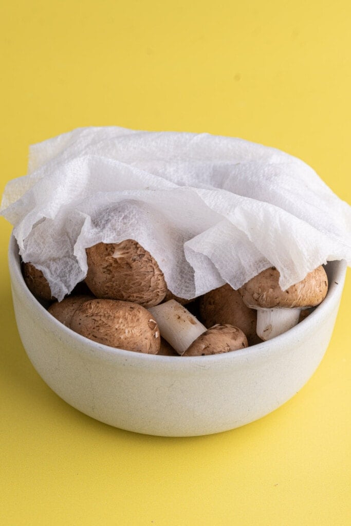 Covering mushrooms with wet paper towel to make them last longer