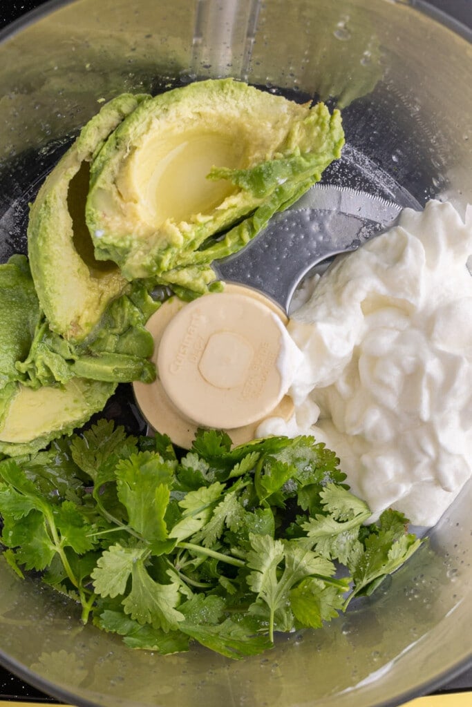 Adding all avocado crema ingredients to food processor