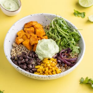 Close crop of Sweet Potato Quinoa Bowl with Avocado Crema