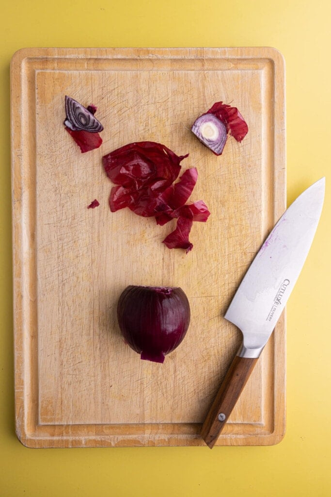 Peeling red onion