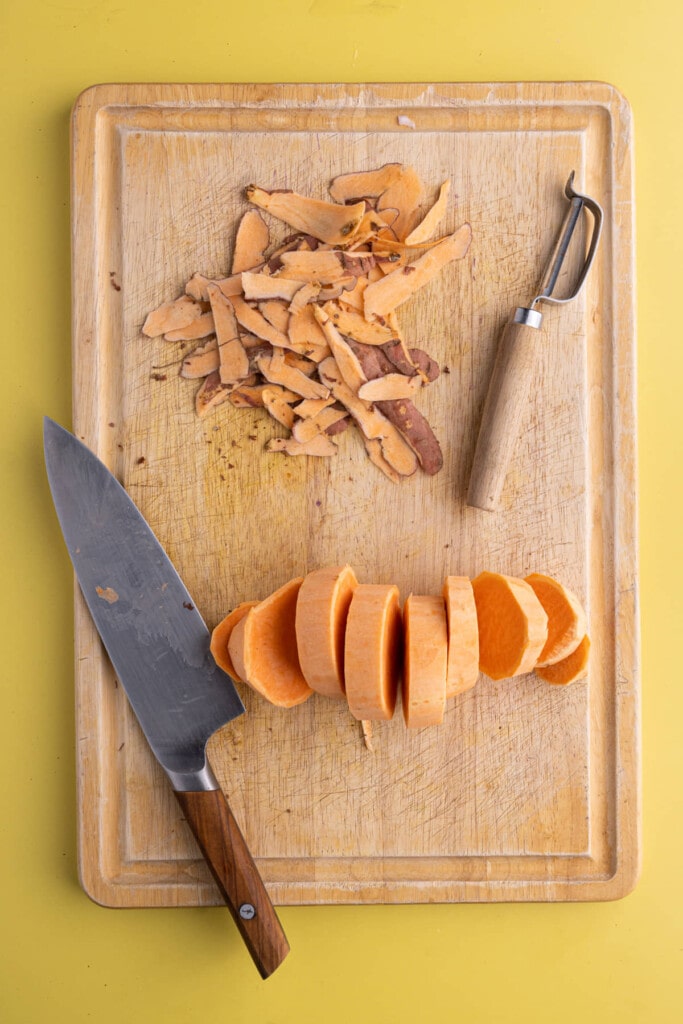 Slicing sweet potato into 1-inch-thick strips