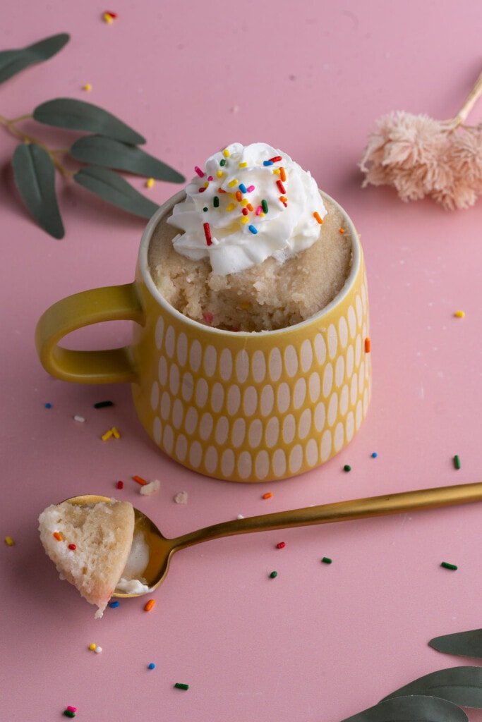 Vegan Vanilla Mug Cake with spoonful scooped out