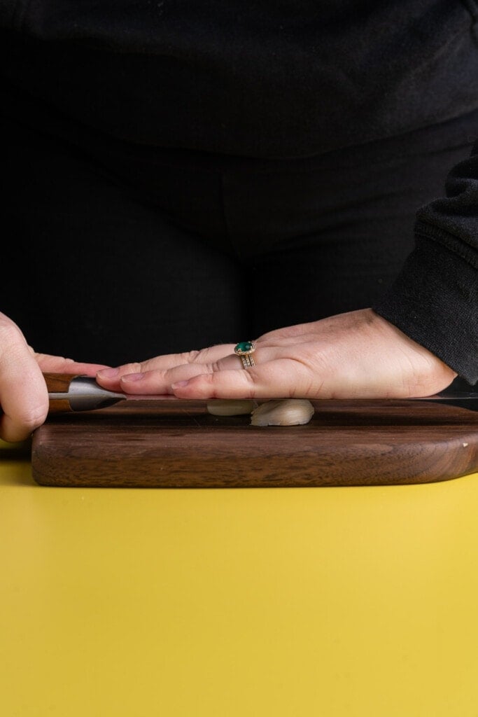 Crushing garlic to make it easier to peel