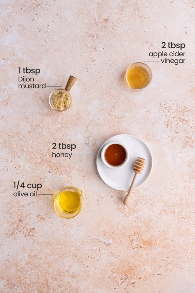 Ingredients for honey Dijon vinaigrette - apple cider vinegar, Dijon mustard, honey, olive oil.
