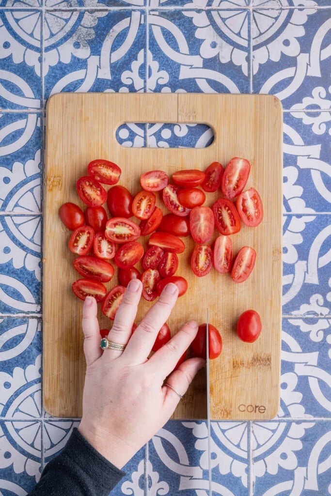 Slicing grape tomatoes in half longways