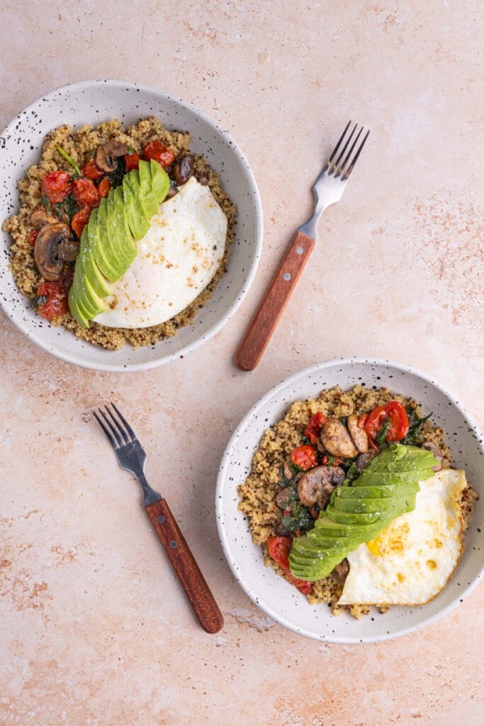 Two assembled Savory Breakfast Quinoa Bowls