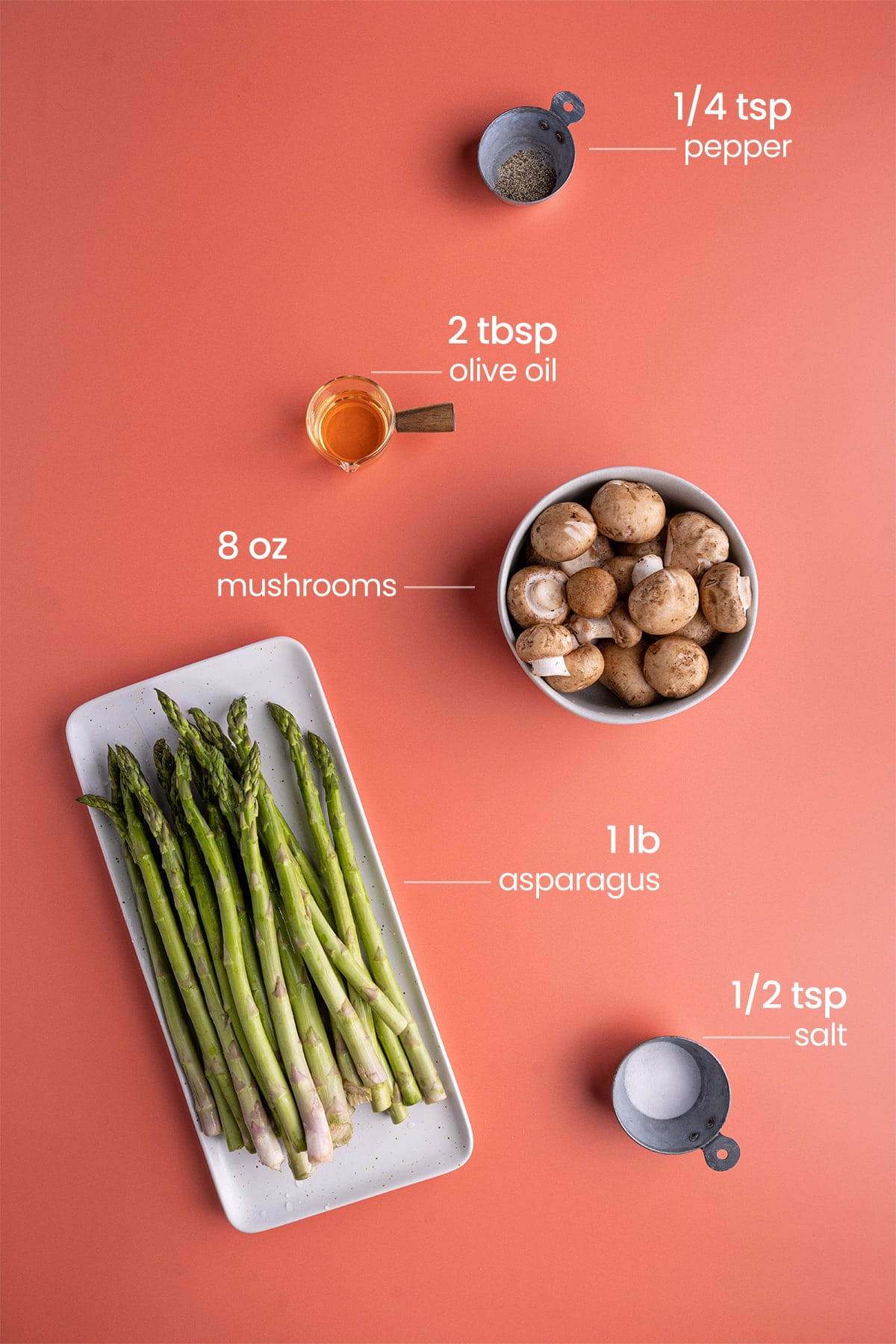 ingredients for roasted asparagus and mushrooms - pepper, olive oil, mushrooms, asparagus, salt