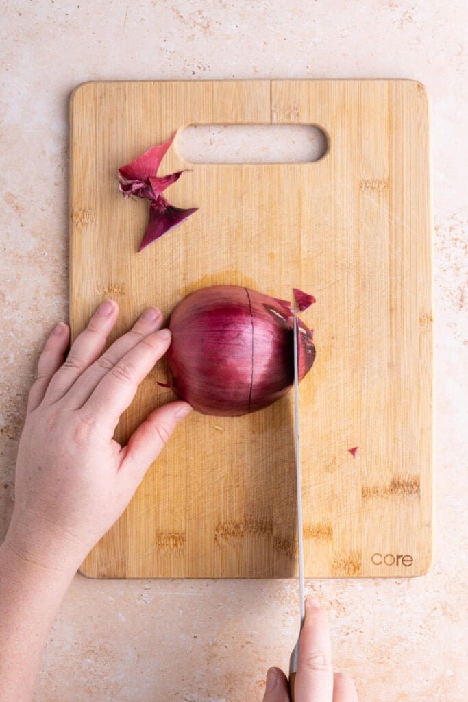 Chopping ends off red onion