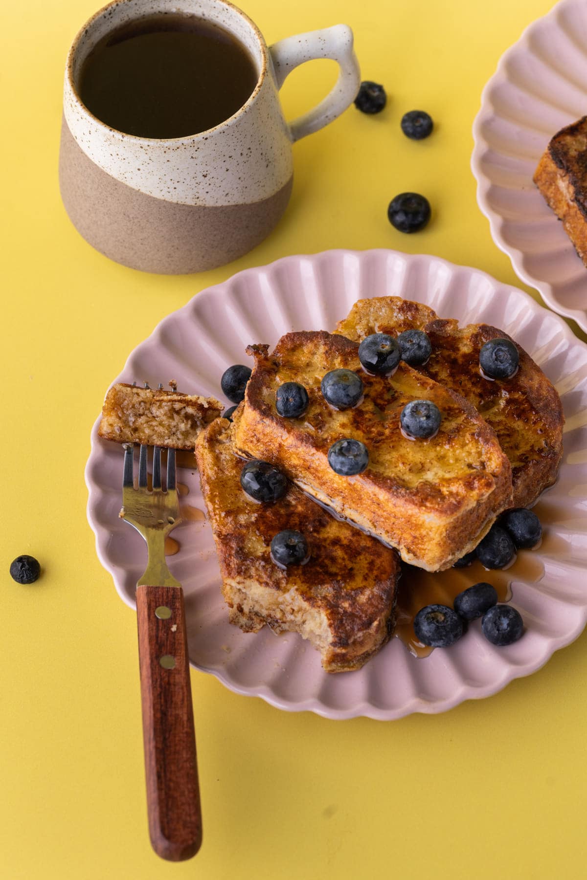Plate of Banana Bread French Toast garnished with blueberries