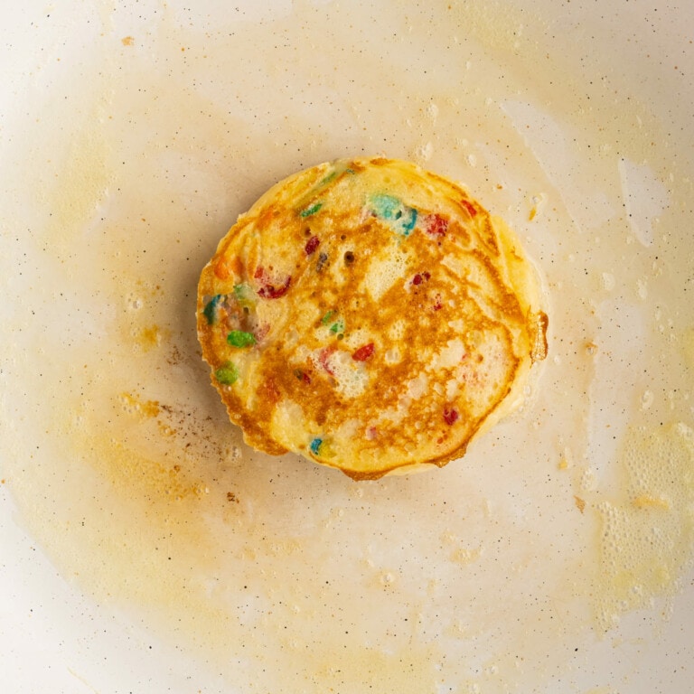 Fruity Pebbles Pancake just flipped in a pan